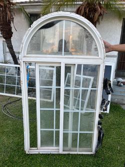 Arched Top Sliding Window Unit White Frame  65” by 35 1/2