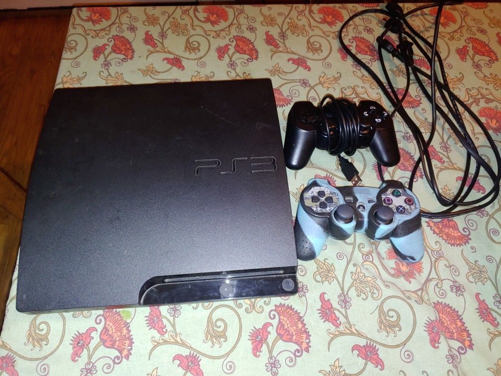 PS3 with 2 controllers and games