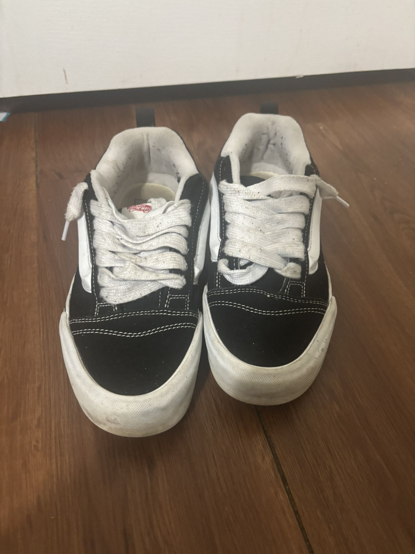 Black and white Vans trainers 