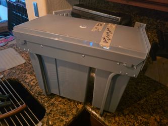 In cabinet slide out trash can