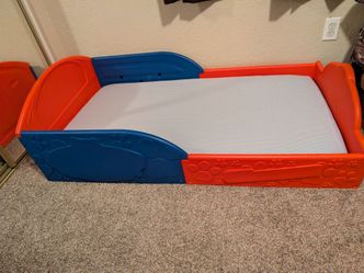 Toddler bed with mattress and cover