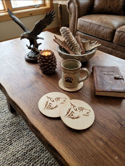 Set Of Four round wooden coasters stylized, tribal-inspired wolf head design