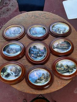 Thomas Kincaid framed collector plates.