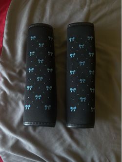 Bow steering wheel cover/seat belt pads