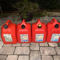 four 5gal gas cans