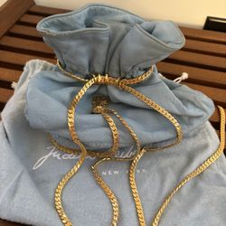 Vintage leather Judith Lieber handbag with gold metal chain with tassels