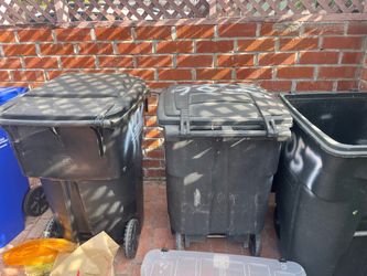 Large black trash cans