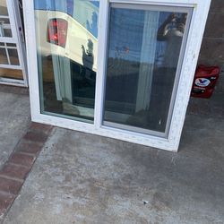 window, vinyl double glass with grids  used window  Has screen  opens side to side slider Height 39 inches Width 46 inches