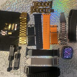 APPLE WATCH ULTRA(GPS+CELLULAR) 49 mm titanium case with lots of bands plus a magnetic charging cable  ￼
