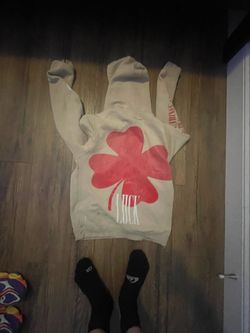 Dismissed Luck Oversize Hoodie In a Beige or Off-white color with a large red shamrock graphic