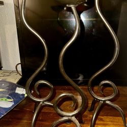 Preowned Set of 3 pillar Candle Holders, cast iron, in three staggered heights.  in excellent condition.  Features: • Staggered sizes: 15 inch, 14 inc