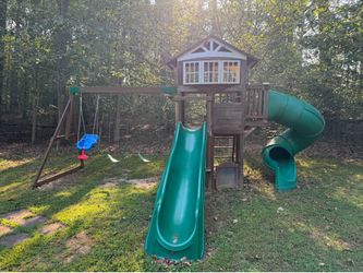 Play yard with slides and swings