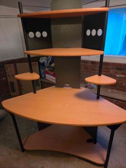 Corner computer desk with shelves.
