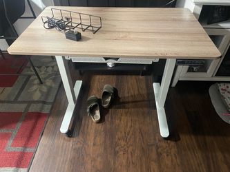 Adjustable height desk