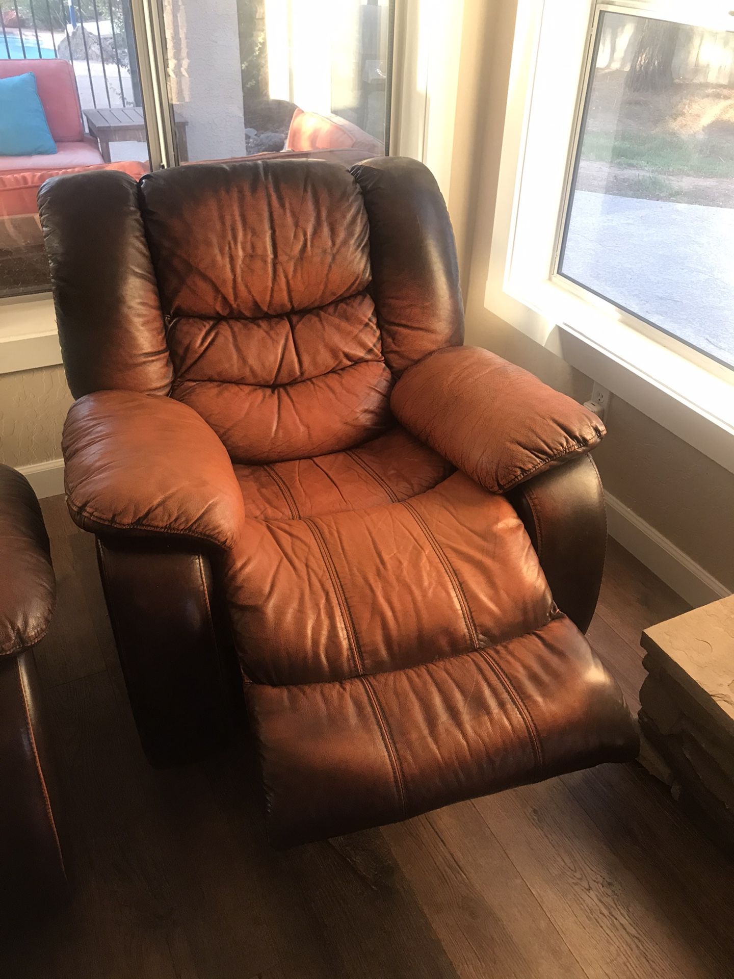 Brown leather recliner couch and one reclining rocker from Ashley Furniture for Sale in Gilbert