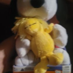 Peanuts Woodstock plush toy, likely a Halloween edition or part of the "Animated Halloween Friends" line sold at CVS. 
The toy is a soft, yellow Woods