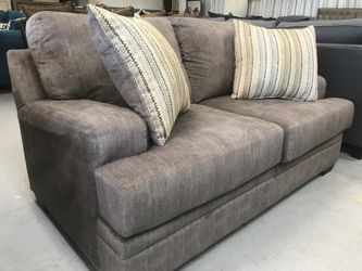 Brand new Loveseat with 2 pillows