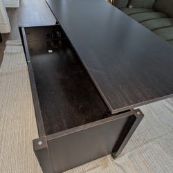 Coffee table with storage lifting top