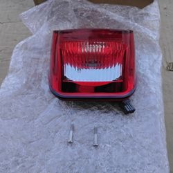 Nice Red Harley-Davidson Rear Brake Light Assembly OEM Factory Brand New. 