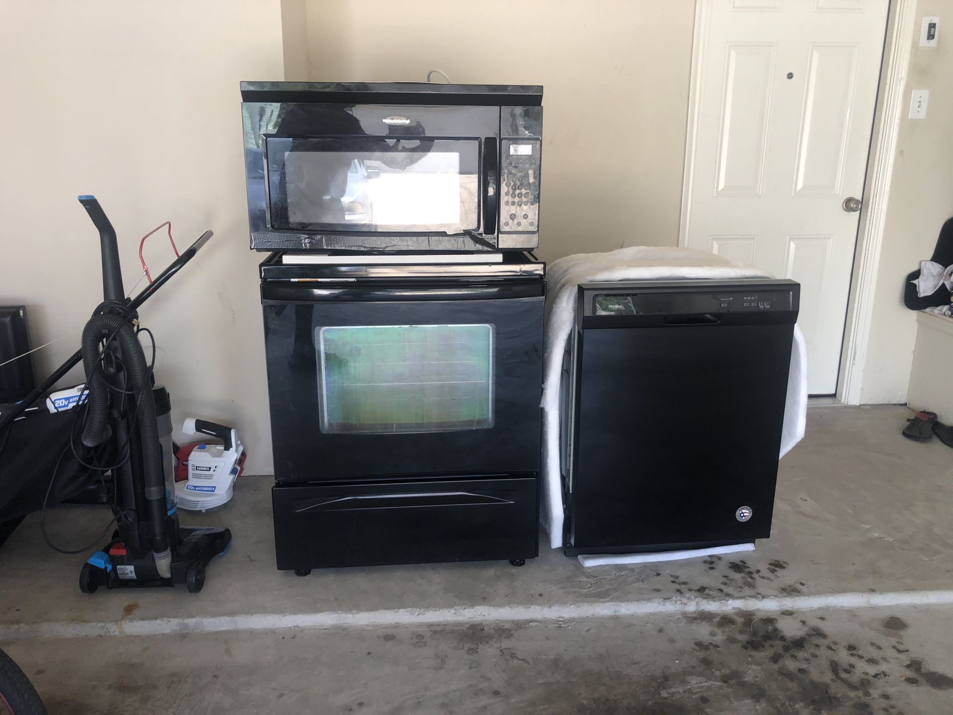 Black used appliances set stove, microwave & dishwasher
