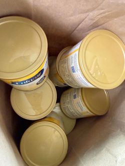 Yellow Enfamil cans