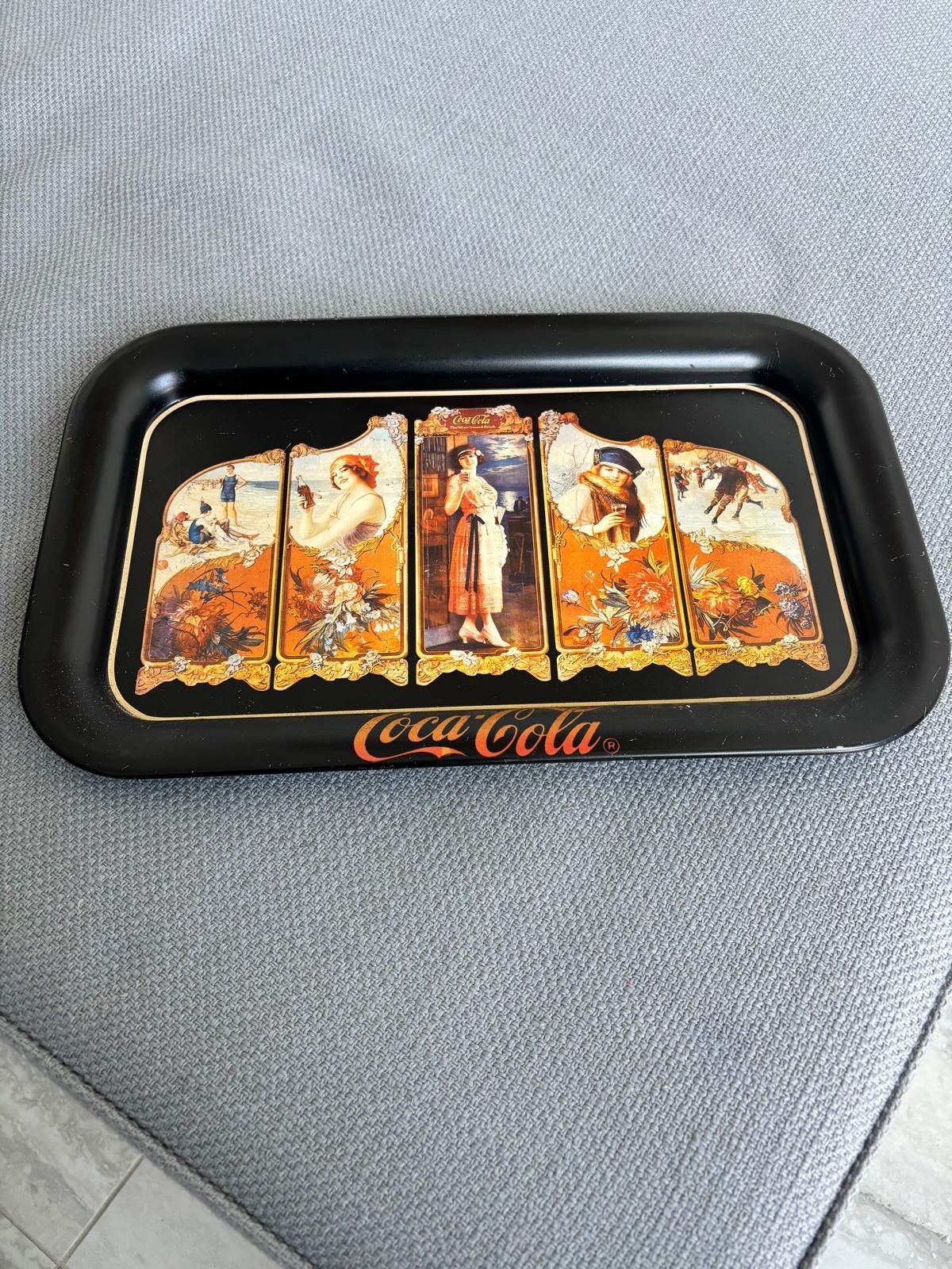 The item is a vintage Coca-Cola serving tray, a reproduction of a 1923 design …copyrighted in 1990… 14 “ x 9”. $20