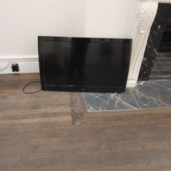 Smart TV And TV Hanger For A Wall