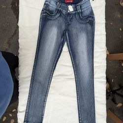 Blue skinny jeans with a 9" rise and 28"(large)