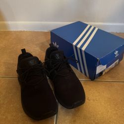 black adidas original with its box