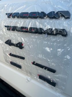 2016-2023 Toyota Tacoma Black Emblem Covers OEM New
