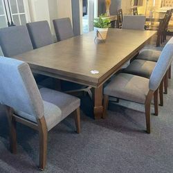 9-Piece Dining Table and Chair Set，$980