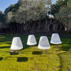 2 Repro Eames Chairs On Brass Color Eiffel Bases