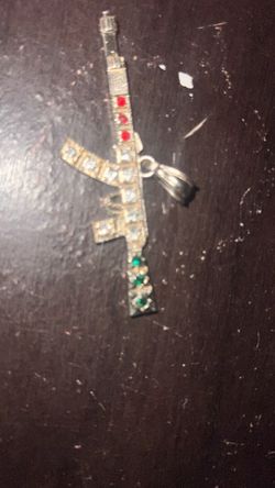 gold gun pendant