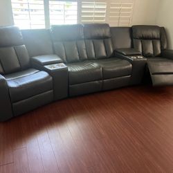 New Power 4 Reclining Theatre Sectional.  Grey Or Ink Blue Gel Leatherette.  138” X 38”.  Free Delivery!
