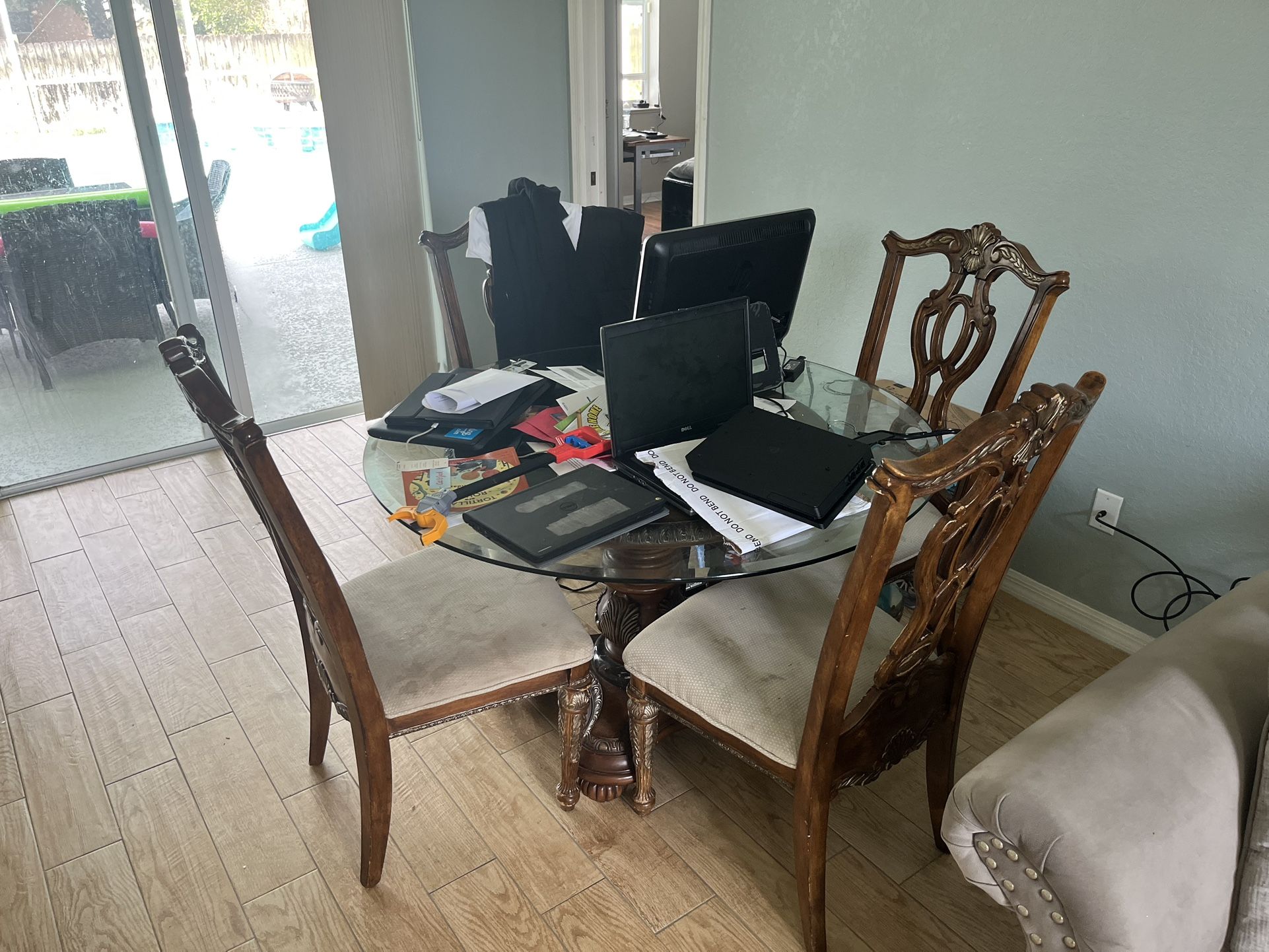 Circular dining table with four chairs