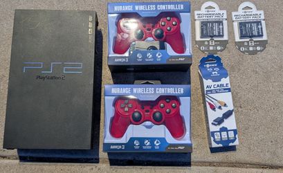 Sony PlayStation 2 "fat" console, specifically model number SCPH-39001 2 wireless controllers