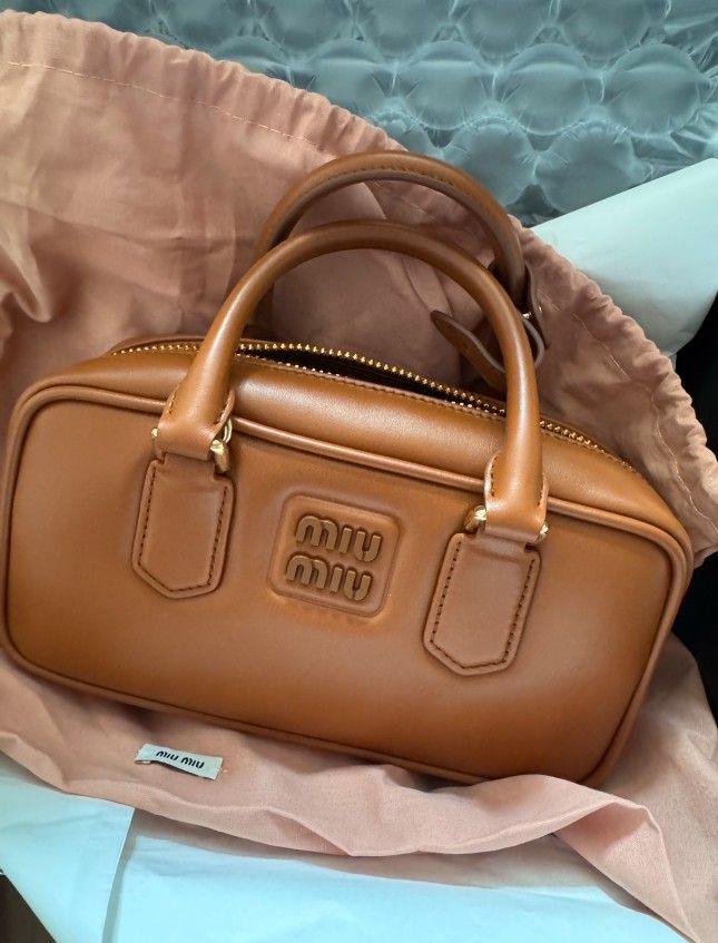 Arcadia series adjustable and detachable shoulder strap leather bowling bag single shoulder crossbody handbag women's cognac color