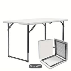 New - foldable table ( 4 feet) ( adjustable height) 