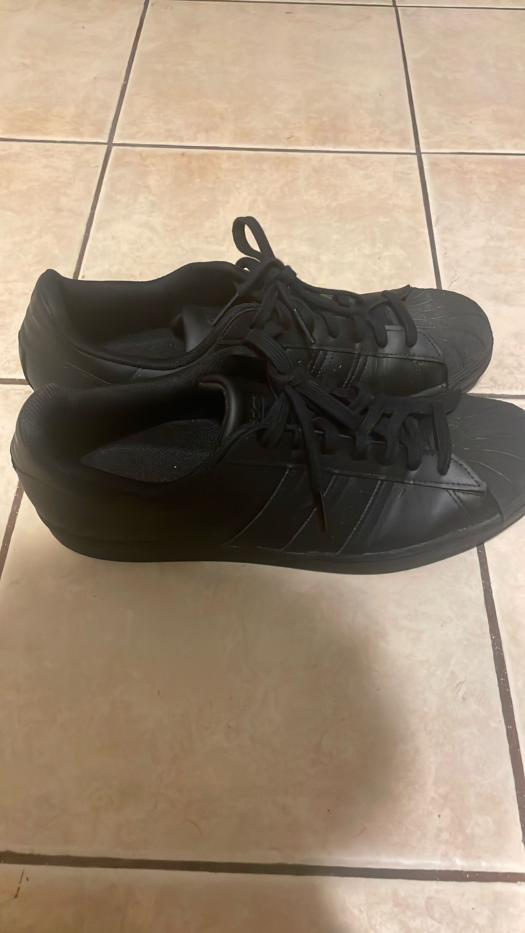 all black adidas superstars