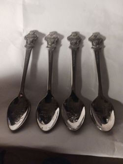 Four vintage Rolex spoons