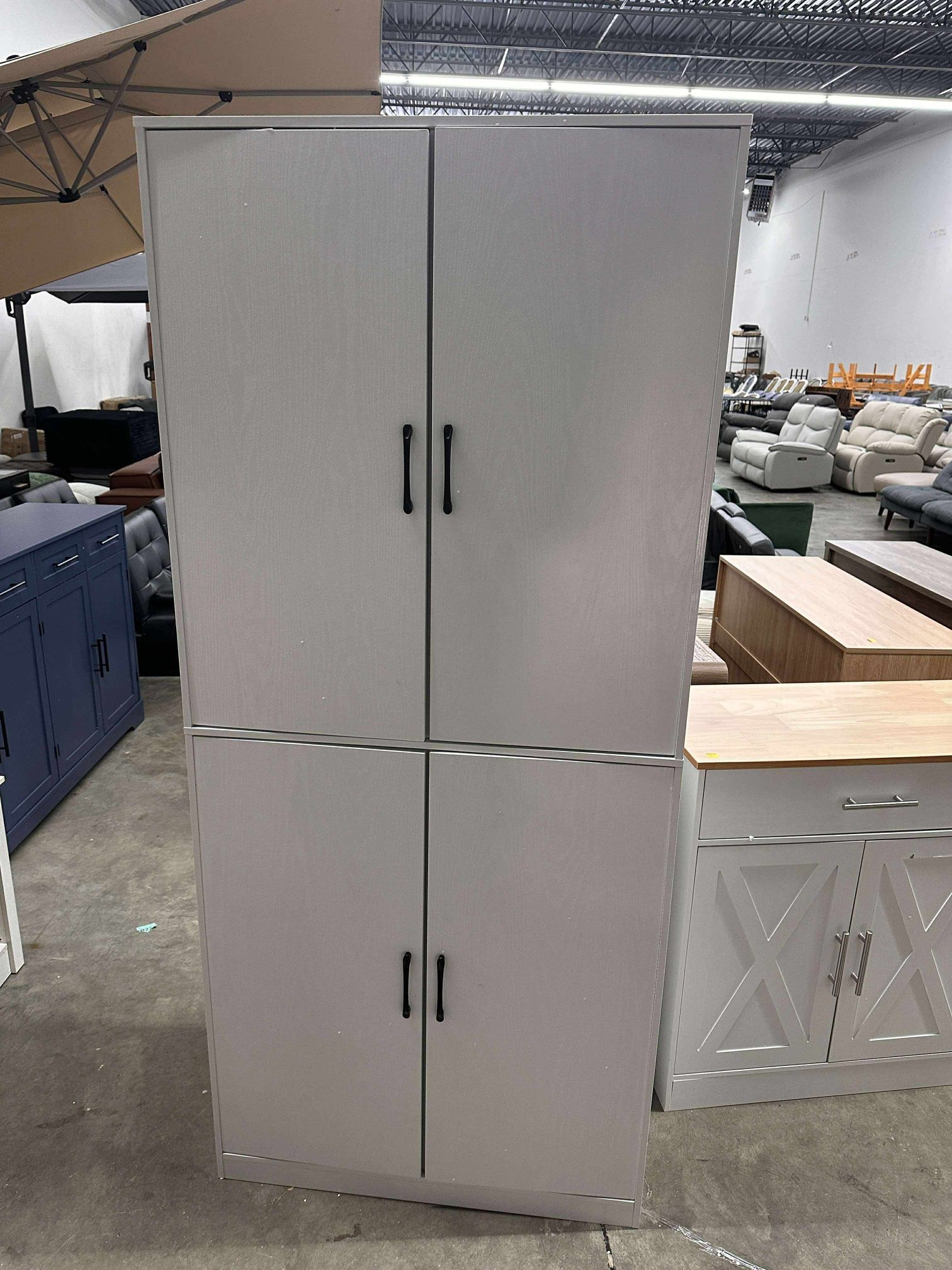 “Tall storage cabinet with pegboard doors