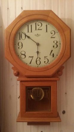 Westminister wall Clock plays melody and has moving pendulum