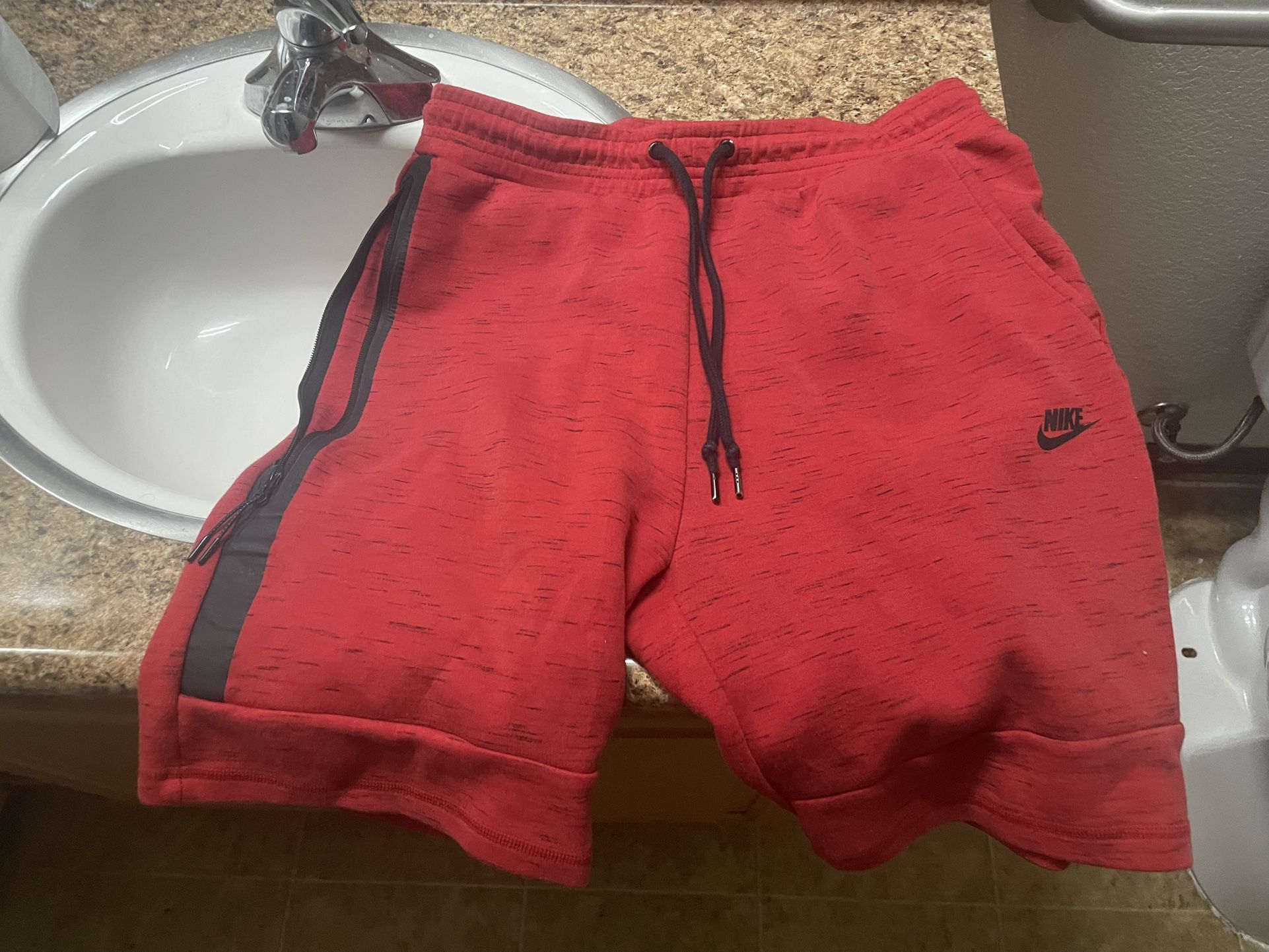 red nike shorts