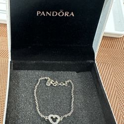 Pandora Disney Mickey Mouse Silhouette sterling silver bracelet with cubic zirconia. 