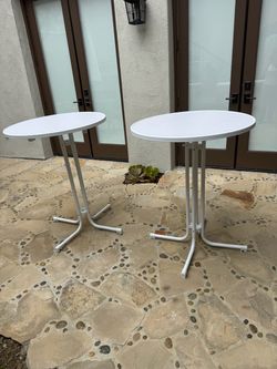 A pair of New 31.5" Round White Plastic Cocktail Table
