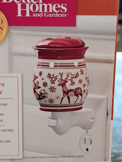 Better Homes and Garden holiday wax warmer joyful holiday reindeer 🦌 
Limited edition 