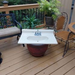 Cultured marbled vanity top with faucet