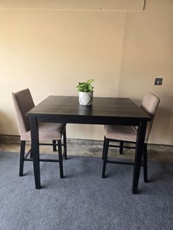 High table with two chairs