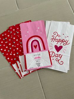 5 new packages of 12 paper bags with 3 different designs all for $4