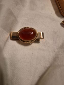 vintage gold-tone tie clip (or tie bar) set with an oval,